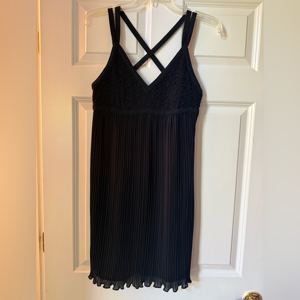Black Sleeveless Dress with Pleated Skirt